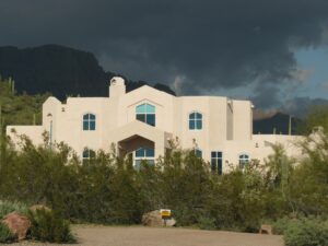 Modern house surrounded by desert landscape In Arizona